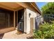 Inviting front entrance featuring a secure door, a storm door, and colorful landscaping at 4226 E Jojoba Rd, Phoenix, AZ 85044