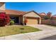 Charming single-Gathering home featuring a two-car garage, beautiful landscaping, and a classic desert tile roof at 4226 E Jojoba Rd, Phoenix, AZ 85044