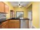 Bright eat-in kitchen with stainless steel dishwasher, tile backsplash, and sink at 4226 E Jojoba Rd, Phoenix, AZ 85044