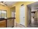 View of the kitchen with wooden cabinets, black countertops and tile floor at 4226 E Jojoba Rd, Phoenix, AZ 85044