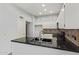 Kitchen featuring ample cabinet space, black countertops, and stainless steel appliances at 4226 E Jojoba Rd, Phoenix, AZ 85044
