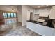 View from kitchen area to living area with hardwood floors at 4226 E Jojoba Rd, Phoenix, AZ 85044