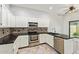 Kitchen showcasing stainless steel appliances and ample storage at 4226 E Jojoba Rd, Phoenix, AZ 85044