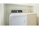 Laundry room featuring a washer and dryer under a shelf at 4226 E Jojoba Rd, Phoenix, AZ 85044