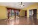 Sun-filled living room featuring hardwood floors and large windows with valance at 4226 E Jojoba Rd, Phoenix, AZ 85044