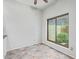 Bright living room featuring tile floors, a ceiling fan, and a large window at 4226 E Jojoba Rd, Phoenix, AZ 85044