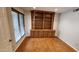 Living room featuring a custom, built-in wooden bookcase at 4226 E Jojoba Rd, Phoenix, AZ 85044