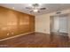 Spacious living room featuring a ceiling fan and wood floors at 4226 E Jojoba Rd, Phoenix, AZ 85044