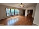 Bright open living room with hardwood floors and large window at 4226 E Jojoba Rd, Phoenix, AZ 85044