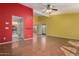 Bright open-concept living room with hardwood floors that flows into the eat-in kitchen with updated appliances at 4226 E Jojoba Rd, Phoenix, AZ 85044