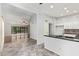 Open-concept living space with tile flooring, a ceiling fan, and a kitchen island at 4226 E Jojoba Rd, Phoenix, AZ 85044
