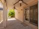 Enjoy this covered patio with brick pavers, ceiling fans, and beautiful landscaping at 4226 E Jojoba Rd, Phoenix, AZ 85044