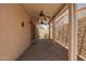 Covered patio featuring neutral stucco walls, brick pavers, and a ceiling fan at 4226 E Jojoba Rd, Phoenix, AZ 85044