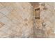 Bathroom shower featuring diamond pattern tile surround with built-in niche for toiletries at 4226 E Jojoba Rd, Phoenix, AZ 85044