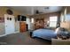 Bedroom with carpeted floor, several windows, and neutral colored paint at 4312 W Olney Ave, Laveen, AZ 85339