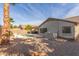 View of backyard featuring a pool, patio with furniture, rock landscaping, and privacy fence at 43554 W Sunland Dr, Maricopa, AZ 85138