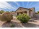 Front exterior featuring desert-style landscaping and a covered porch, showcasing the home's curb appeal at 43554 W Sunland Dr, Maricopa, AZ 85138