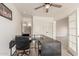 Spacious home office featuring modern desk and bright lighting at 43554 W Sunland Dr, Maricopa, AZ 85138