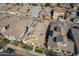 An aerial view of a residential neighborhood showcasing orderly street layouts, manicured lawns, and varied home styles at 4498 E Bethena St, Gilbert, AZ 85295