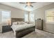 Bedroom features a ceiling fan, plantation shutters, and matching night stands at 4498 E Bethena St, Gilbert, AZ 85295