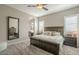 Bedroom featuring a wooden bed frame, and views into the ensuite bathroom at 4498 E Bethena St, Gilbert, AZ 85295