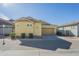 Well-maintained exterior of a single-Gathering home featuring a two-car garage, landscaped front yard, and stucco facade at 4498 E Bethena St, Gilbert, AZ 85295