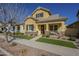 Attractive two-story home with well-kept lawn and covered front porch at 4498 E Bethena St, Gilbert, AZ 85295