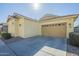 Exterior showcasing a two-car garage with a well-maintained driveway and tidy landscaping at 4498 E Bethena St, Gilbert, AZ 85295