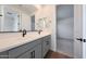 Bathroom featuring gray cabinets, double sinks, and a view into bedroom at 4552 W Willow Run --, San Tan Valley, AZ 85144