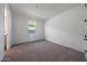 An empty bedroom with neutral carpet, light walls and a bright window at 4552 W Willow Run --, San Tan Valley, AZ 85144