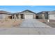 Charming single-story home featuring a two-car garage and low-maintenance desert landscaping at 4552 W Willow Run --, San Tan Valley, AZ 85144