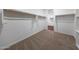 Walk-in closet with carpet flooring, shelves and multiple clothing racks at 4552 W Willow Run --, San Tan Valley, AZ 85144