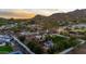 Aerial of property displaying pool, outdoor living space, lush trees, and surrounding neighborhood at 5016 E Butler Dr, Paradise Valley, AZ 85253