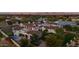 Estate aerial view showcasing mature trees, tile roof, tennis court, and outdoor living spaces at 5016 E Butler Dr, Paradise Valley, AZ 85253