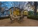 Outdoor dining area and a charming exterior view of a home, enhanced by soft lighting and greenery at 5016 E Butler Dr, Paradise Valley, AZ 85253