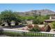 Scenic view from the patio, showcasing a beautiful desert landscape with mountains in the background, framed by lush greenery at 5016 E Butler Dr, Paradise Valley, AZ 85253