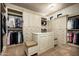 Spacious closet with custom shelving, drawers, and a center island with seating, perfect for organizing your wardrobe at 5016 E Butler Dr, Paradise Valley, AZ 85253