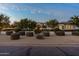 Home exterior with manicured shrubs and trees lining the front yard at 5016 E Butler Dr, Paradise Valley, AZ 85253