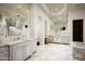 Elegant bathroom with marble flooring, dual vanities, and a luxurious soaking tub at 5016 E Butler Dr, Paradise Valley, AZ 85253