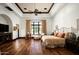 Spacious main bedroom with hardwood floors, tray ceiling, and natural light at 5016 E Butler Dr, Paradise Valley, AZ 85253