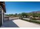 A large patio with a view of the desert landscape, ideal for outdoor living and entertaining, with a decorative railing at 5016 E Butler Dr, Paradise Valley, AZ 85253