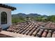 Tile rooftop view of the mountain range and surrounding greenery, offering a serene and picturesque backdrop at 5016 E Butler Dr, Paradise Valley, AZ 85253