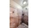 The elegant walk-in shower features stone-look walls, a decorative border and modern fixtures at 5350 E Deer Valley Dr # 3277, Phoenix, AZ 85054