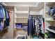 Organized walk-in closet featuring shelving with ample storage and hanging space for clothing and accessories at 5350 E Deer Valley Dr # 3277, Phoenix, AZ 85054