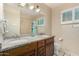 Bright bathroom boasts double sinks with granite countertops and a shower with neutral tile at 5401 N 81St Pl, Scottsdale, AZ 85250