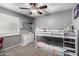 Bedroom featuring a bunk bed, carpet flooring, window with shutters, and a dresser at 5401 N 81St Pl, Scottsdale, AZ 85250