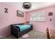 Cozy bedroom with pink walls, carpet flooring, window with shutters, and a comfortable bed at 5401 N 81St Pl, Scottsdale, AZ 85250