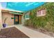 Inviting front entrance with a charming walkway, lush greenery, and stylish front door at 5401 N 81St Pl, Scottsdale, AZ 85250