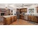 Kitchen showcasing stainless appliances, granite countertops, and access to the brick fireplace area at 5401 N 81St Pl, Scottsdale, AZ 85250