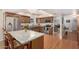 Kitchen featuring stainless appliances, wood cabinets, and granite counters with access to a seating area at 5401 N 81St Pl, Scottsdale, AZ 85250